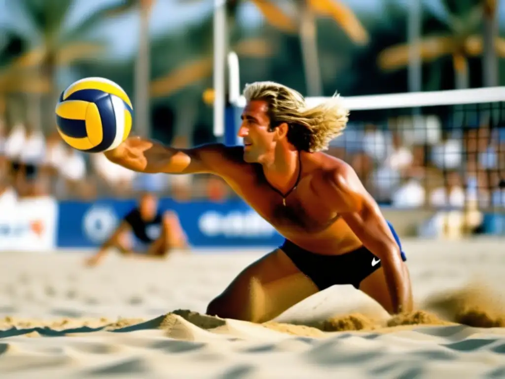 Un joven Karch Kiraly se lanza por una pelota en la cancha de vóley playero, su cabello largo ondea mientras se estira para salvarla