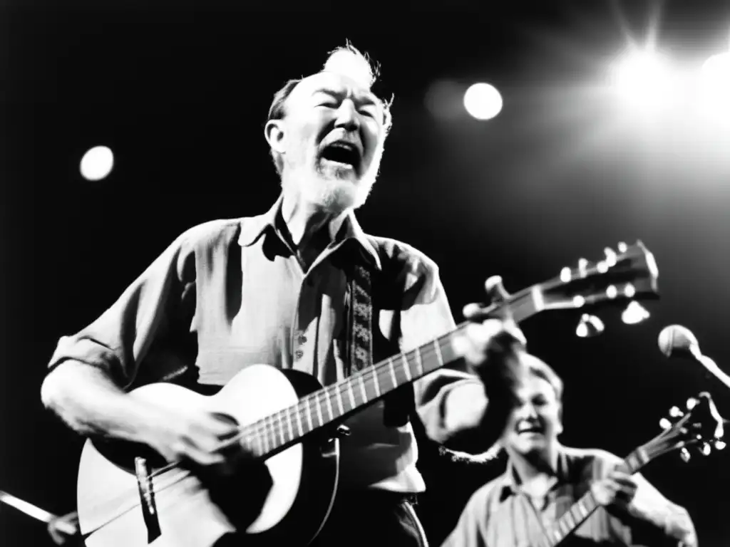 Pete Seeger toca apasionadamente su banjo en el escenario, mientras la multitud lo aplaude